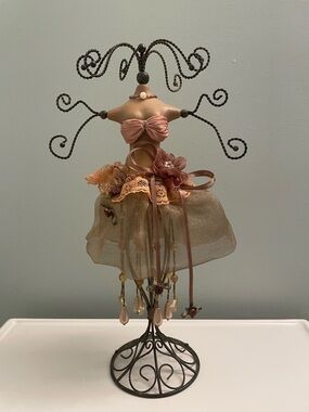Decorative vintage Dress Form Jewelry Stand in light brown dress and black stand